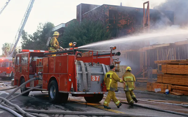 E4H image of a fire truck spraying water onto the building thats on fire