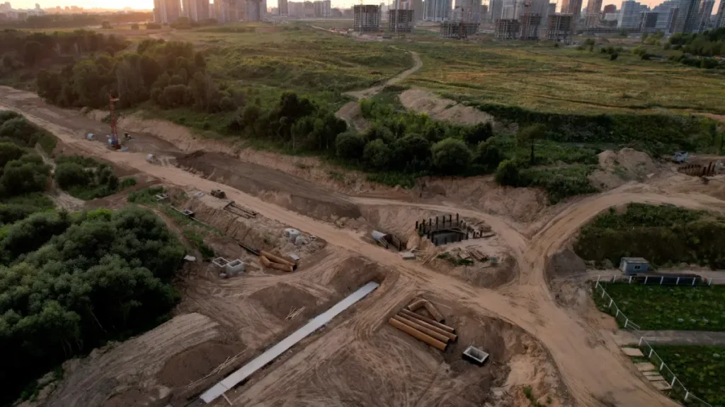 E4H image of a clear construction site, surrounded by trees