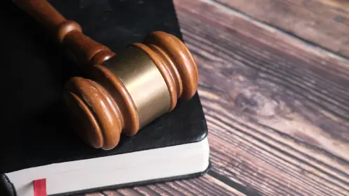 E4H image of a legal document book, with a gavel on top